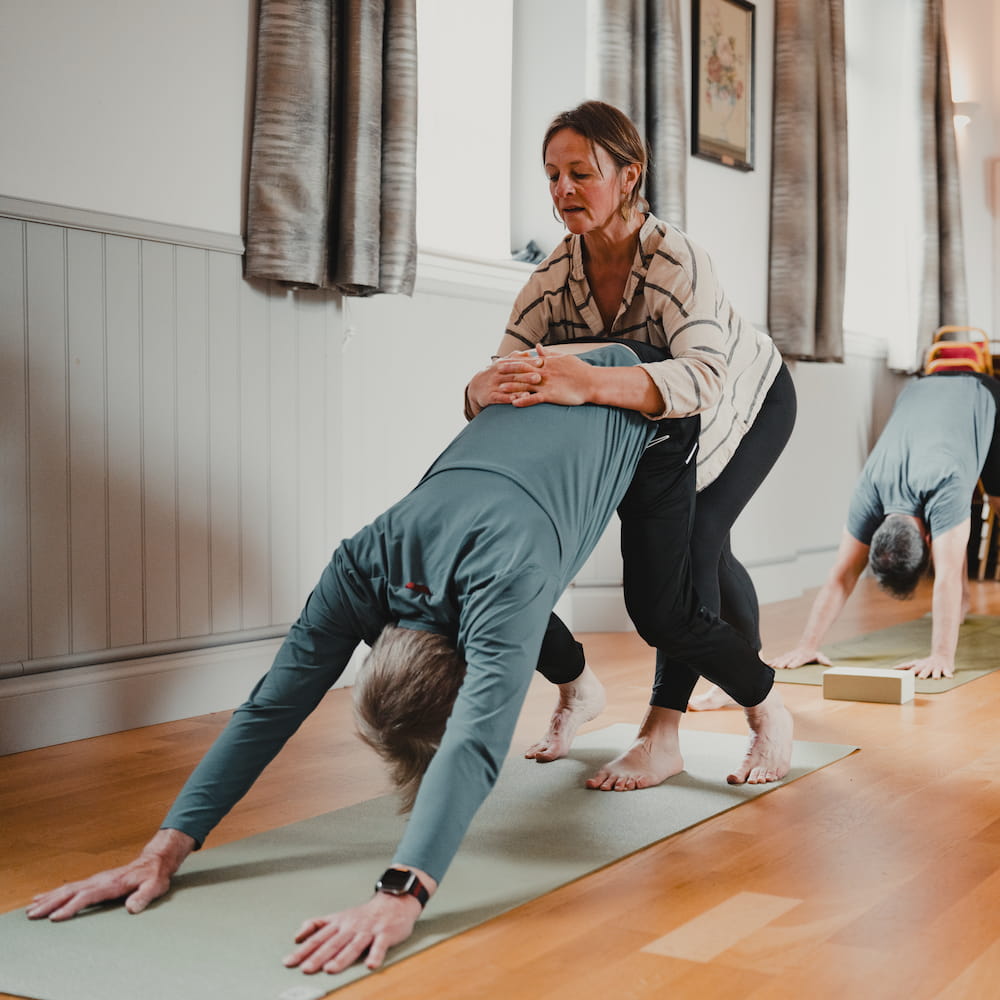 A candid moment from a yoga class at Comrie Rural Hall.